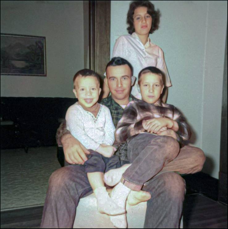 Michael, father Luwarren “Bud” Luick, and siblings Debra and David